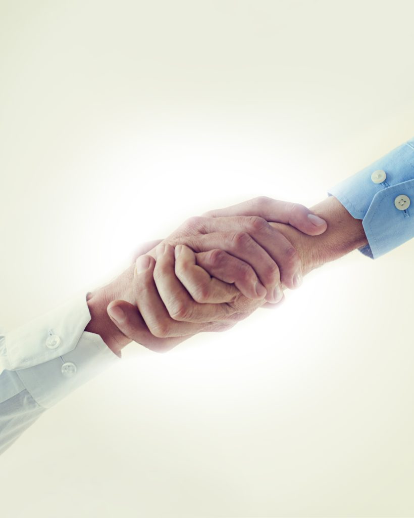 Low angle, business people and handshake with partnership, agreement and promotion. B2b deal, shaking hands and thank you with mockup space or cooperation for a project or collaboration with contract.